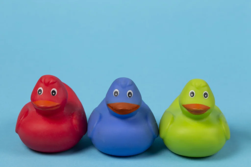 multicolored-rubber-ducks-blue-background