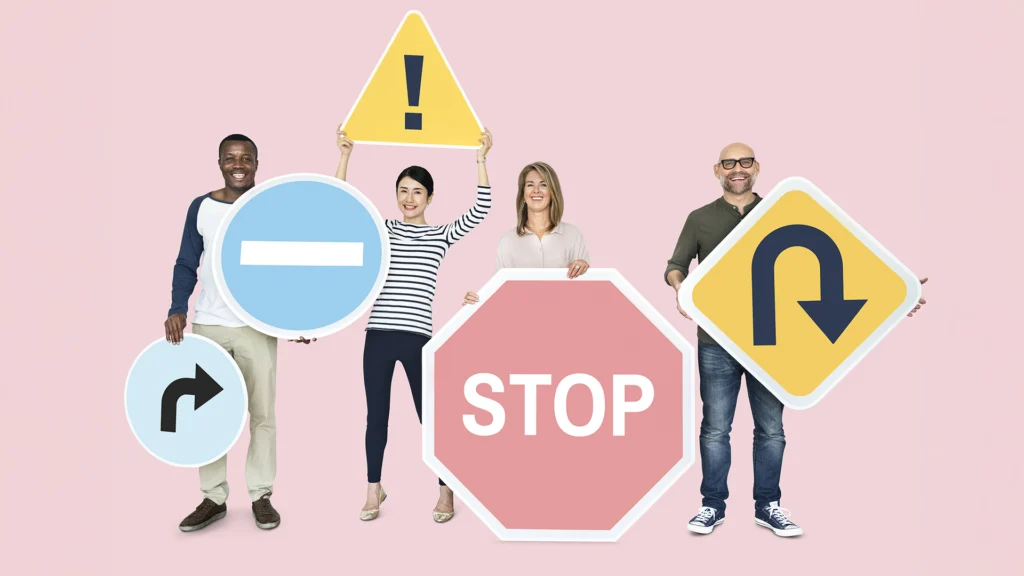 People holding road signs